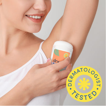 Woman applying dermatologist tested Dry Idea plant-based deodorant